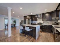 Open kitchen featuring an island with marble countertop and seating for two at 52 Buena Vista Se Cir, Cartersville, GA 30121