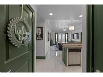 Welcoming entryway featuring marble floors that leads to a modern living space and kitchen at 2255 Peachtree Ne Rd # 521, Atlanta, GA 30309