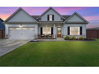 Charming one-story home with a manicured lawn, two-car garage and inviting front porch, showcasing curb appeal at 39 Summer Nw Pl, Cartersville, GA 30121
