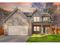 Charming two-story home with a brick facade, attached two-car garage, and well-manicured lawn at 4806 Forest Trl, Douglasville, GA 30135