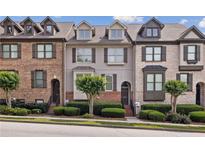 Charming townhomes with brick and stucco exteriors and well-maintained landscaping at 3133 Dunton Se St, Smyrna, GA 30080
