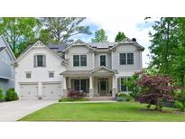 Beautiful two-story home with a well-manicured lawn, two-car garage and solar panels at 533 Beecham Dr, Smyrna, GA 30082