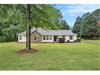 Charming single-story home with a stone facade and well-manicured front yard at 110 Peach Pointe Dr, Mcdonough, GA 30253