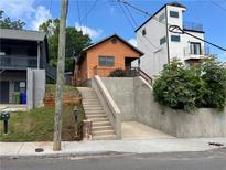 Cozy orange home featuring an elevated position, with stair access and modern design elements, great curb appeal at 226 Walnut Nw St, Atlanta, GA 30314