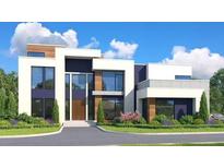 Stunning modern home featuring a stylish facade with large windows and a well-manicured lawn at 7504 Rivertown Rd, Fairburn, GA 30213