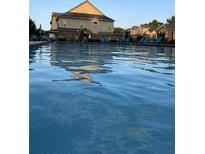 Community pool with lounge chairs, perfect for relaxing on a hot summer day at 106 Trailside Way, Hiram, GA 30141