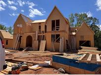 New construction home showing framing and wooden building materials at 6740 Pannell Rd, Buford, GA 30518