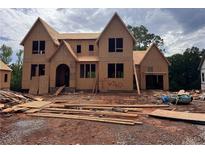 New construction home with an unfinished exterior and a modern design at 6740 Pannell Rd, Buford, GA 30518