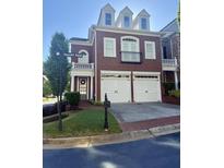 Charming red brick home with a two-car garage and well-manicured lawn in a desirable neighborhood at 11715 Dancliff Trce, Alpharetta, GA 30009
