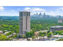 A high-rise building overlooking lush greenery and the city skyline at 2881 Peachtree Ne Rd # 1102, Atlanta, GA 30305