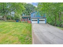 Charming, two-story home featuring a freshly painted exterior and a two-car garage at 3178 Booths Ct, Dacula, GA 30019