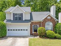 Charming two-story home with a brick facade, attached garage, and well-maintained landscaping at 2967 Albright Cmns, Kennesaw, GA 30144