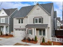 Charming two-story home with neutral siding, stylish shutters, and a two-car garage in a desirable community at 1006 Fendley St, Woodstock, GA 30188