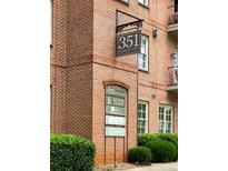 Exterior of building with brick facade and signage at 351 Washington Avenue, a stately well maintained property at 351 Ne Washington Ne Ave # 307, Marietta, GA 30060