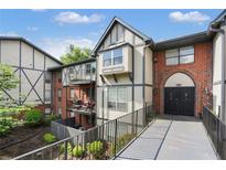 Attractive condo with brick and siding exterior and well-maintained landscaping at 6851 Roswell Rd # K-23, Atlanta, GA 30328