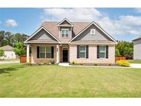 Charming brick home with a well-manicured lawn and inviting curb appeal at 1809 Hanwoo Ln, Powder Springs, GA 30127