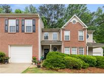 Charming brick home with manicured landscaping and a welcoming front entrance at 360 Parkview Manor Dr, Tucker, GA 30084