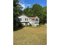 Charming two-story home with gray siding, black shutters, and a well-maintained front yard at 615 Amberwood Pl, Euharlee, GA 30145