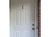 Apartment front door with white paint and the number one on the front at 1651 Massachusetts Sw Ave # 1, Marietta, GA 30008