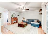Inviting living room features hardwood floors, natural light, and comfortable seating arrangements at 1445 Monroe Ne Dr # F18, Atlanta, GA 30324