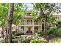 Charming two-story home with double porches, inviting curb appeal and mature trees at 1014 Seaboard Nw Ave, Atlanta, GA 30318