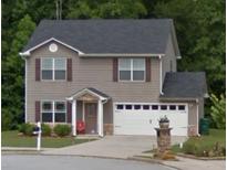 Charming two-story home featuring a gray exterior, attached garage, and well-maintained front lawn and walkway at 4368 Rocky View Dr, Forest Park, GA 30297