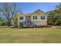 Charming two-story home with a well-manicured lawn and welcoming front porch at 2821 Highway 11, Mansfield, GA 30055