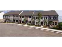 New townhomes featuring brick and siding exteriors, large windows, and professionally landscaped yards at 357 Skylar Se Ct, Atlanta, GA 30315