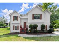 Charming two-story home with red shutters and a well-maintained front lawn at 8436 Cyprus Ridge Way, Douglasville, GA 30134