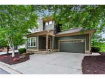 Charming two-story home with a well-manicured lawn and a two-car garage in a leafy neighborhood at 2765 Prado Ln, Marietta, GA 30066