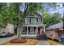 Charming two-story home with a welcoming front porch and landscaped yard at 802 Chestnut Nw, Atlanta, GA 30314