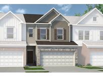 Charming townhome featuring a stone accent front and an attached two car garage at 123 Ravencliff Dr # 80, Austell, GA 30168