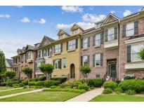 Charming townhomes feature a mix of brick and siding exteriors, manicured lawns, and inviting curb appeal at 1229 Concord Se Rd, Smyrna, GA 30080