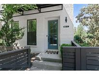 Inviting front entrance features a blue-green door and brick facade at 1815 La Dawn Nw Ln, Atlanta, GA 30318