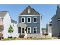 Charming two-story home with blue siding, a yellow door, and a welcoming front porch at 2729 Creek View Nw Ter, Atlanta, GA 30318