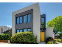 Modern two-story home featuring large windows, and a bright yellow front door at 53 Daniel Se St, Atlanta, GA 30312