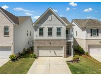 Charming two-story home with a brick and siding exterior and a well-manicured lawn at 3723 Silvery Way, Powder Springs, GA 30127