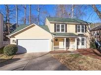 Charming two-story home with a two-car garage and beautifully landscaped front yard at 194 Beaverwood Ct, Lawrenceville, GA 30044