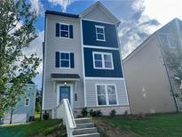 Charming two-story home featuring a blue front door, gray siding, and dark blue accents at 2719 Stream Valley Lane Nw Nw Cir, Atlanta, GA 30318