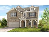 Charming two-story home features a brick facade, a covered porch, and an attached two-car garage at 3198 Shirecrest Ln, Dacula, GA 30019