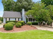 Charming home featuring a well-maintained lawn and mature landscaping, creating an inviting curb appeal at 2790 Shiloh Way, Snellville, GA 30039