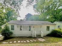 Charming single-story home featuring a traditional design and a well-maintained front yard at 1440 Kenilworth Sw Dr, Atlanta, GA 30310