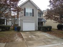 Charming two-story home featuring a one-car garage and a cozy front porch with stone accents at 2019 Briar Creek Ne Ct, Conyers, GA 30012