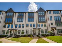 Stylish new construction townhomes feature light brick, dark accents, and lush landscaping at 6790 Encore Blvd, Sandy Springs, GA 30328