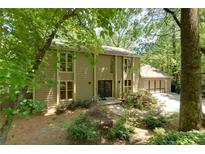 Charming two-story home featuring large windows, a well-maintained yard, and a two-car garage at 1760 Little Willeo Rd, Marietta, GA 30068