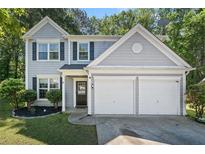Charming two-story home featuring a two car garage, well-maintained lawn, and inviting front entrance at 4104 Glenaire Nw Way, Acworth, GA 30101
