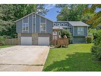 Charming two-story home with stone accents and attached two-car garage at 2673 Deerfield Sw Cir, Marietta, GA 30064