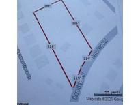 A map showing lot lines and dimensions of the property at 4897 Lou Ivy Rd, Peachtree Corners, GA 30096