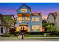 Charming three-story home boasts a welcoming front porch, second-floor balcony, and an additional top-floor balcony at 4550 Lois Se St, Smyrna, GA 30080