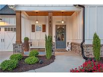 Charming front porch with stylish decor and a welcoming bench at 141 Alaina Rd, Canton, GA 30115